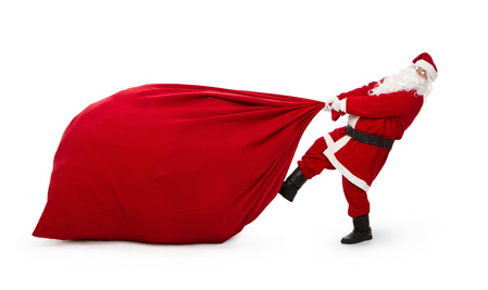 Santa Claus with huge bag full of presents isolated